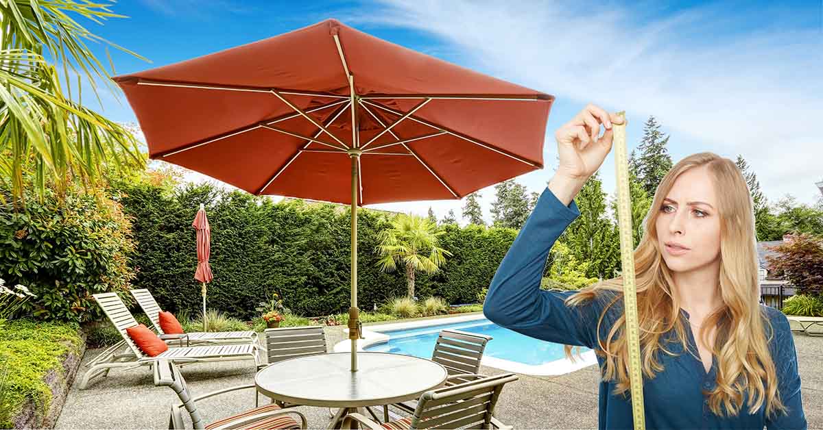 Woman with a tape measure looking to measure the patio umbrella size