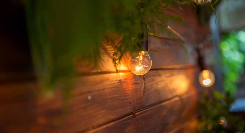 Hang outdoor lights in backyards structures