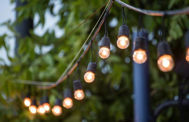 Outdoor string lights with metal poles