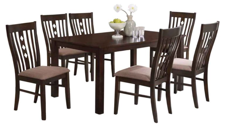 Wooden folding chairs arranged around a table set for indoor dining