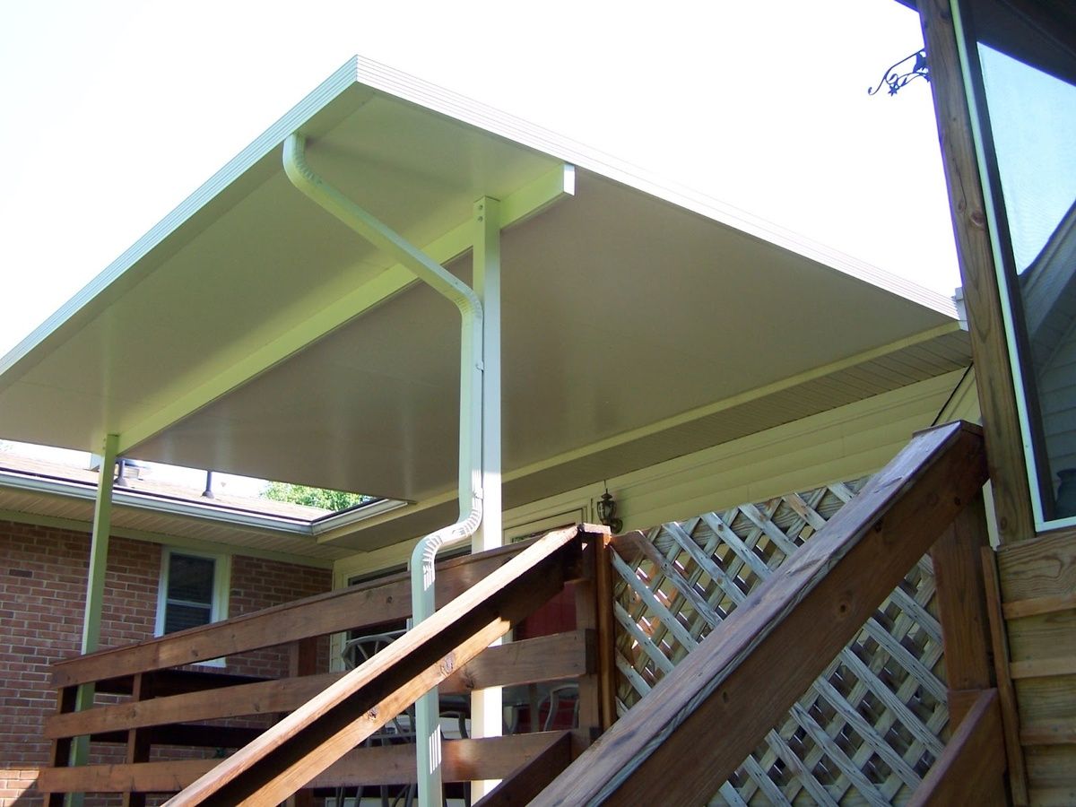 Solid aluminium patio cover over a wooden deck seen from below